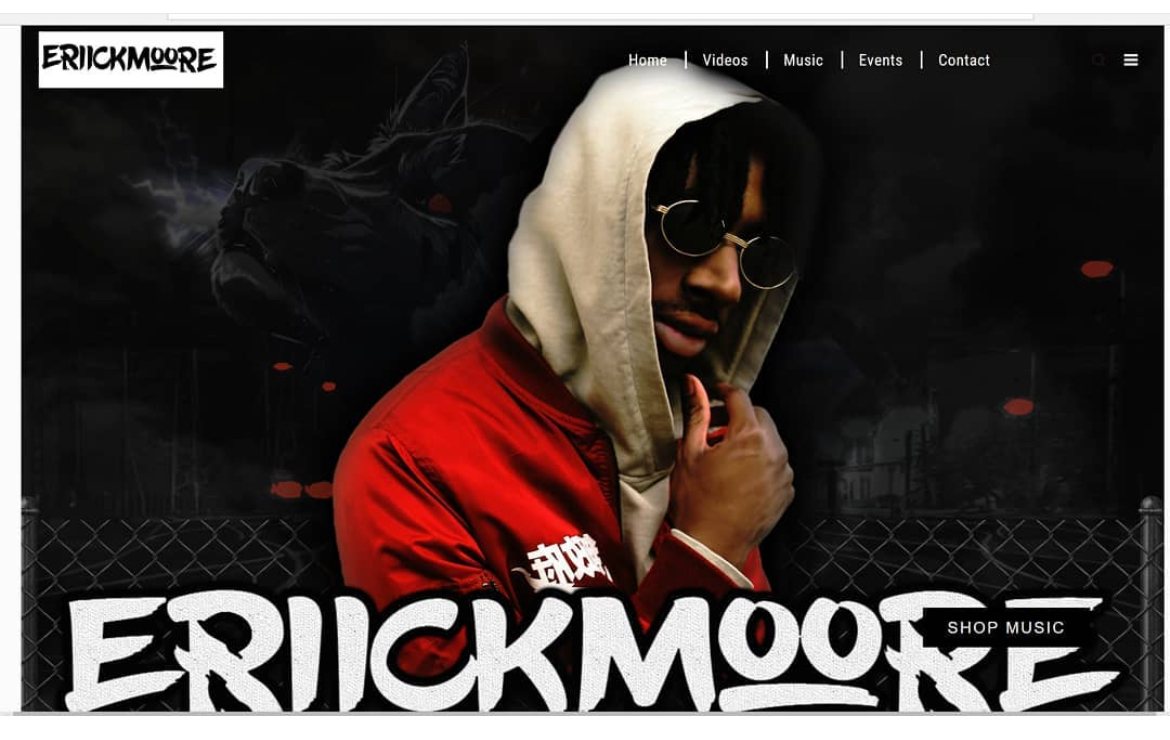 The Erick Moore artist site: a full-bleed photograph with a graffiti-style wordmark across the base and navigation for videos, music, events and contact.